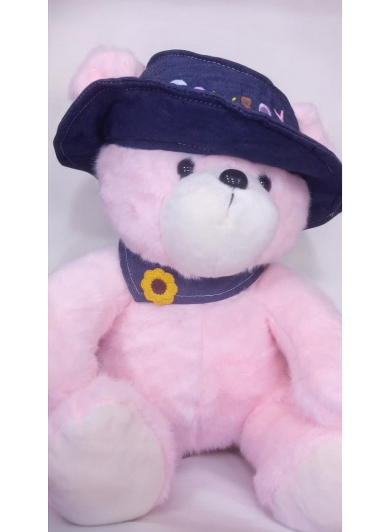 Teddy bear with denim hat and rose